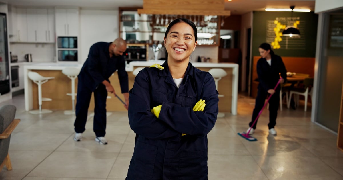 Professional cleaning team in uniform ready for post-event cleanup