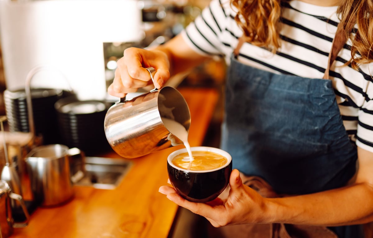 Barista preparing coffee — bring café-quality brewing home with VORA