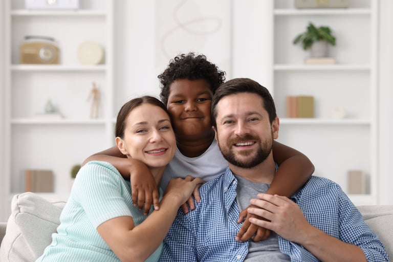 Happy adoptive family at home