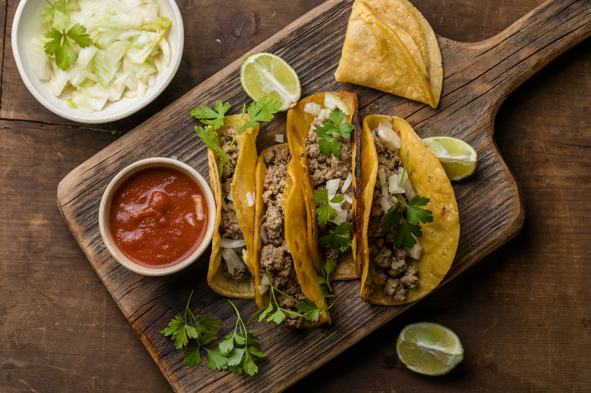 Traditional Mexican birria tacos with beef, cheese and rich consommรฉ