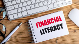 FINANCIAL LITERACY text on spiral notepad