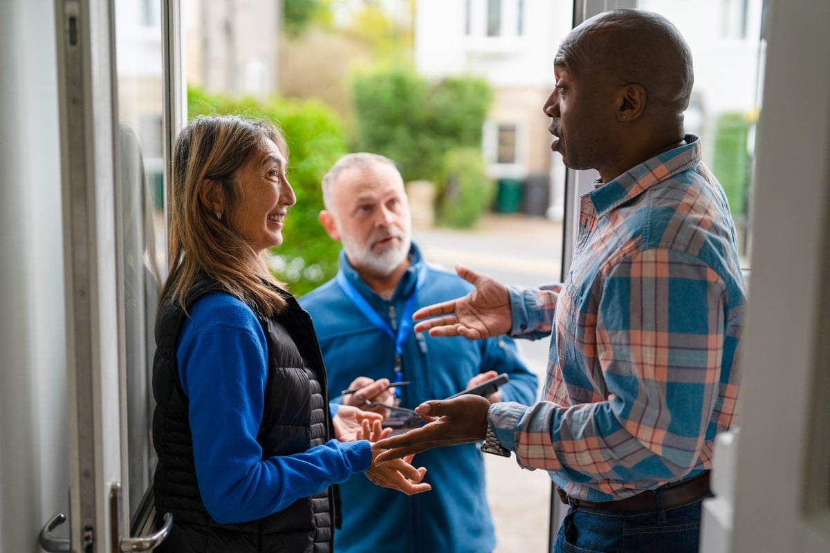 Satisfied homeowner with HVAC technician