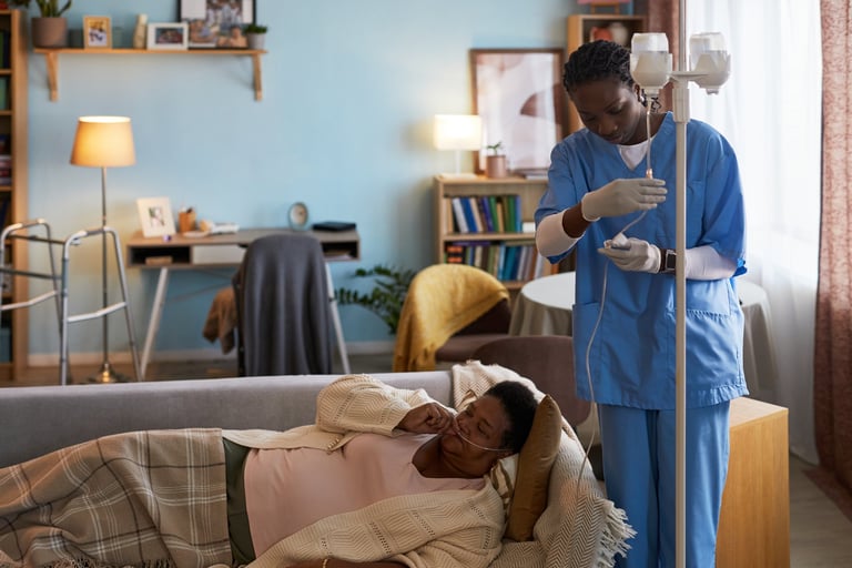 Senior woman receiving intravenous therapy from nurse at home