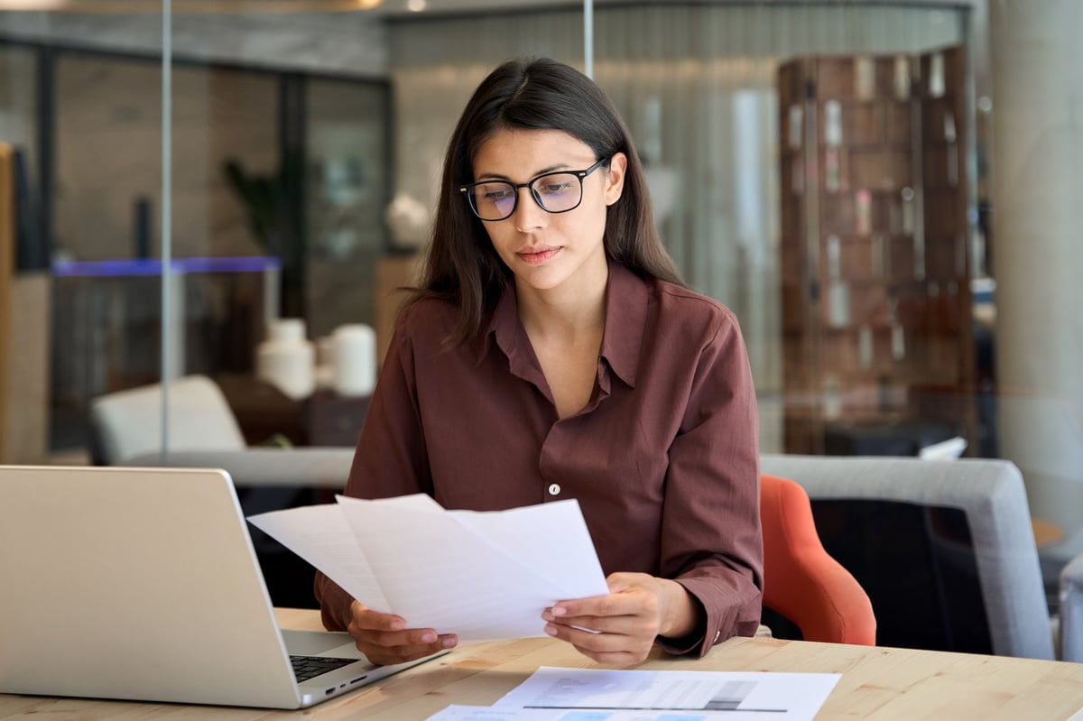 Borrower reviewing credit and financial documents on a laptop