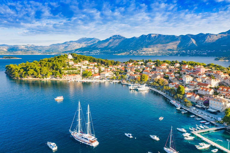 Coastal Croatian town of Cavtat with historic architecture and blue Adriatic water