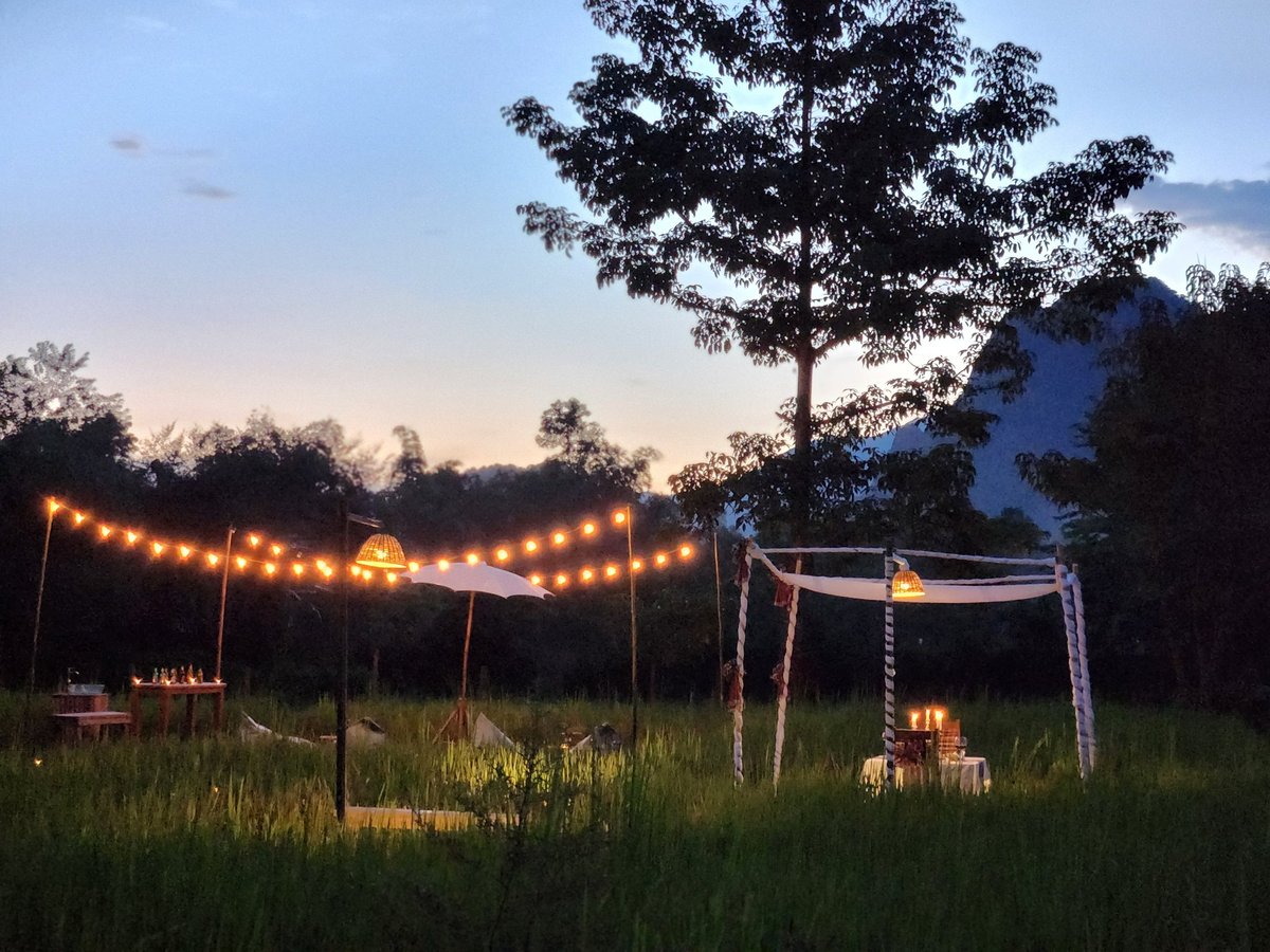 Romantic evening outdoor setup with warm string lights and a soft dreamy atmosphere