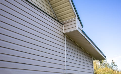 Clean vinyl siding on house with blue sky