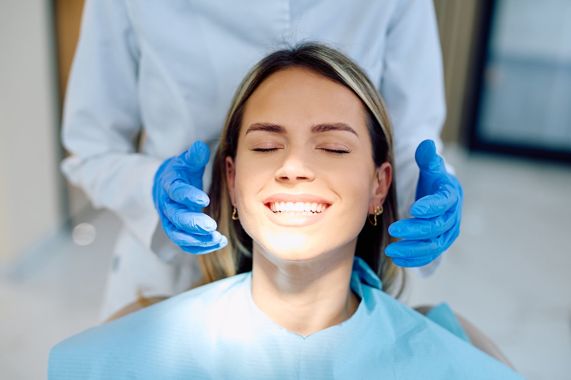 Happy patient with bright teeth after cosmetic bonding treatment at a North Hollywood dentist