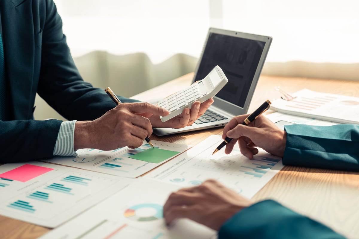 Taycan Advisors confidential employee financial wellness review — advisor and client discussing debt resolution program options