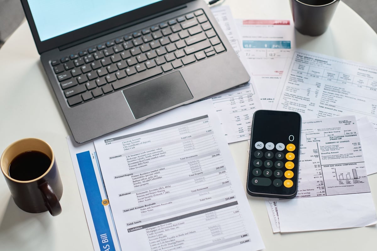 Investor and loan officer reviewing short-term rental income and DSCR financing options