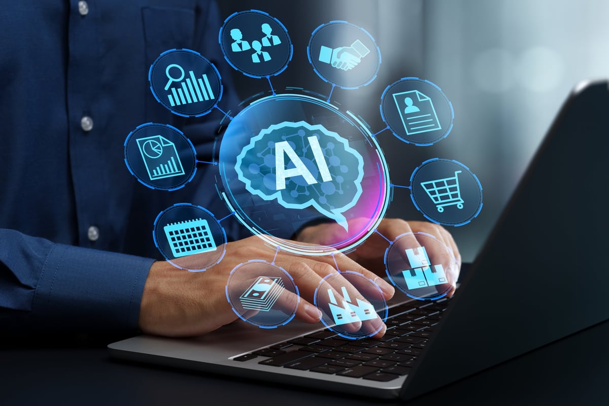 Businessperson using laptop to manage projects