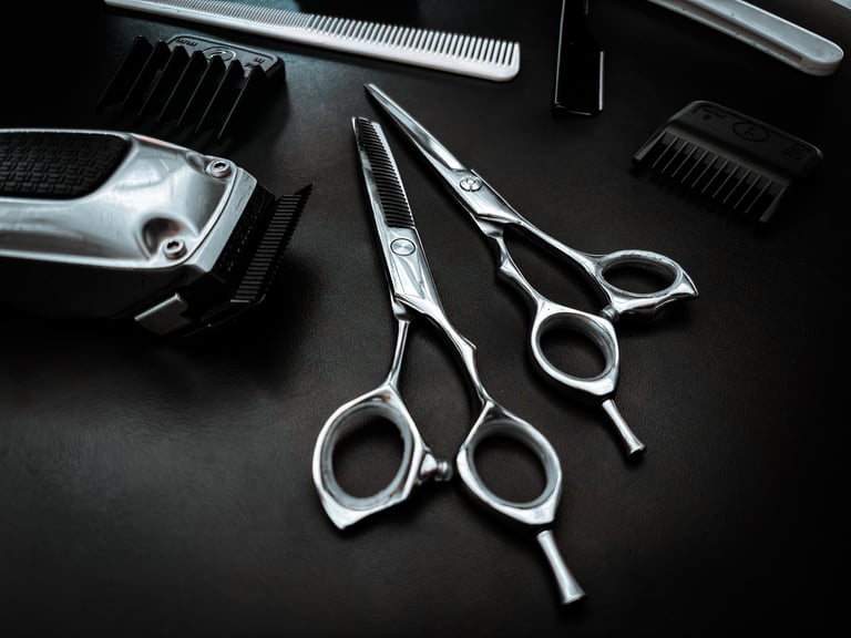 Haircut tools organized on dark background