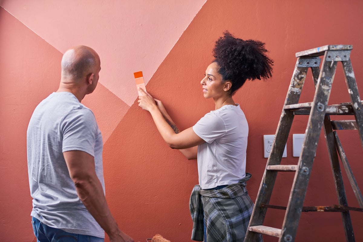 Team applying a decorative paint finish to a wall