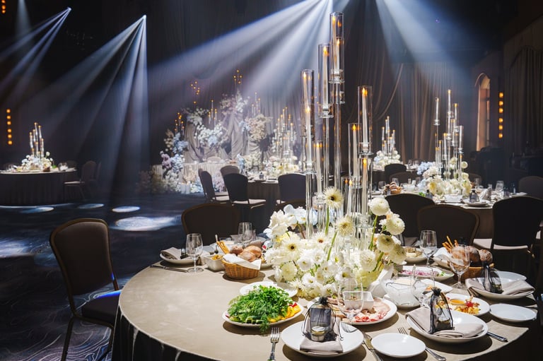 Elegantly decorated banquet hall with candlelit tables at the FAB Women Christmas Soiree Woman of the Year gala celebration