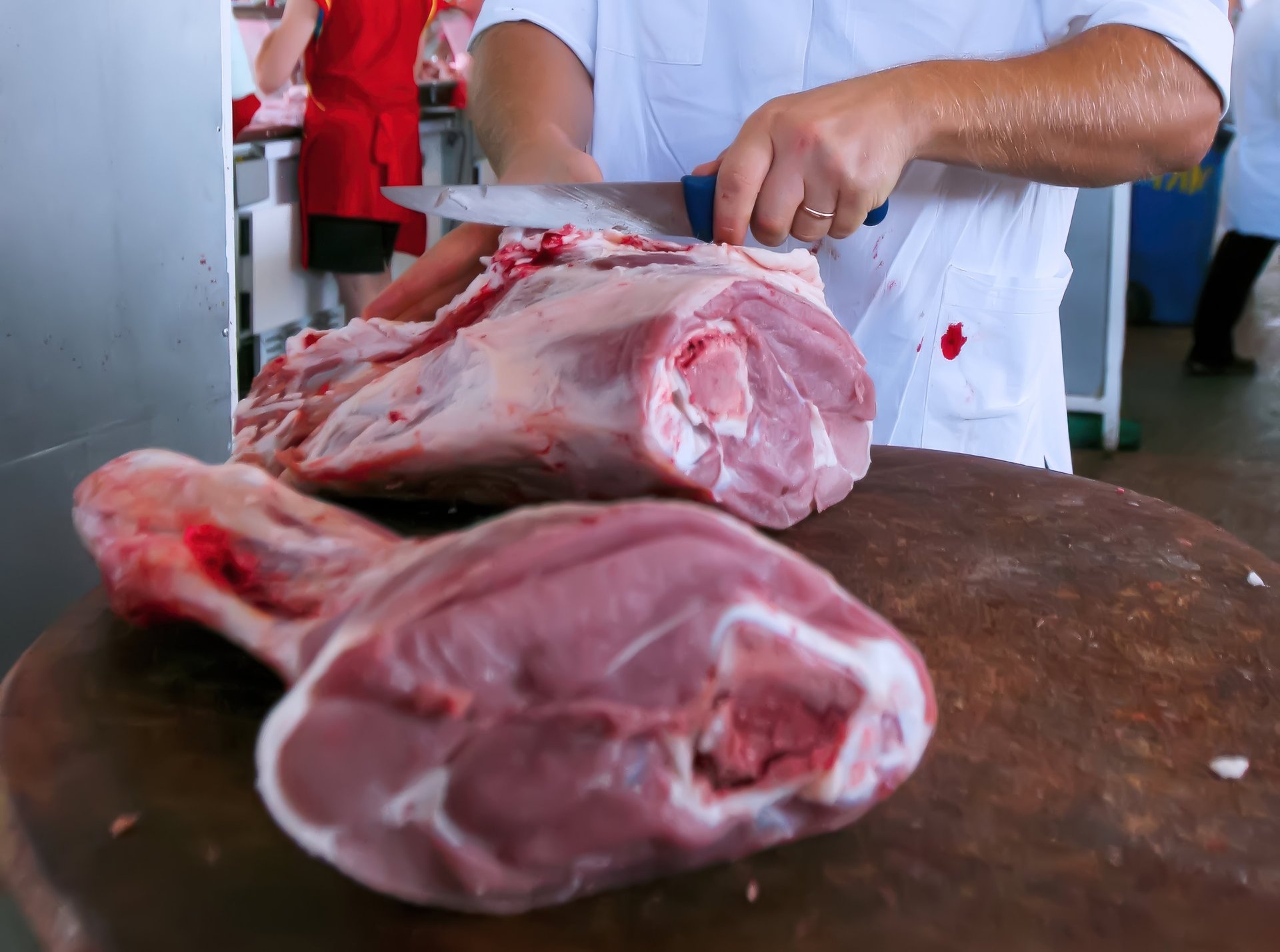 Professional butcher preparing meat