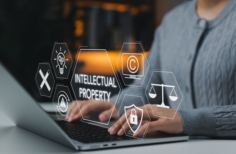 Intellectual property protection concept. Woman working on laptop with copyright, patent, security, and legal icons