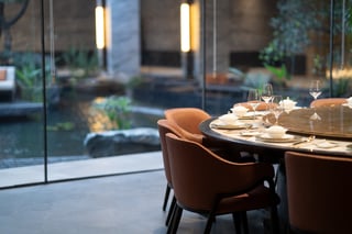 Elegant restaurant dining setup by garden view