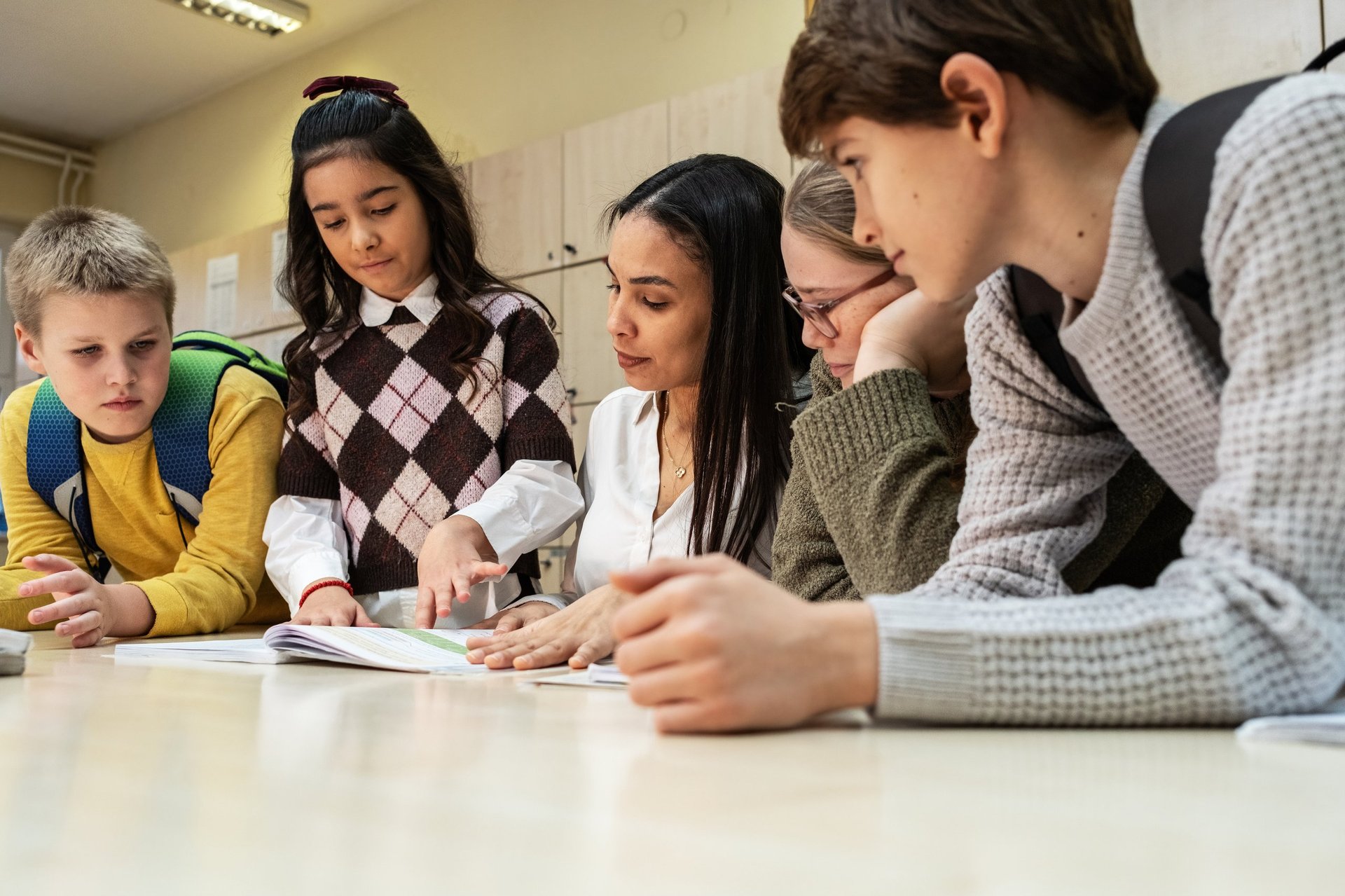 A teacher guiding elementary students through a mathematics lesson in a Lighthouse classroom