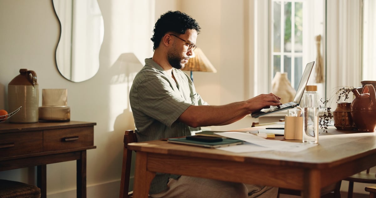 Person focused on work at a home desk