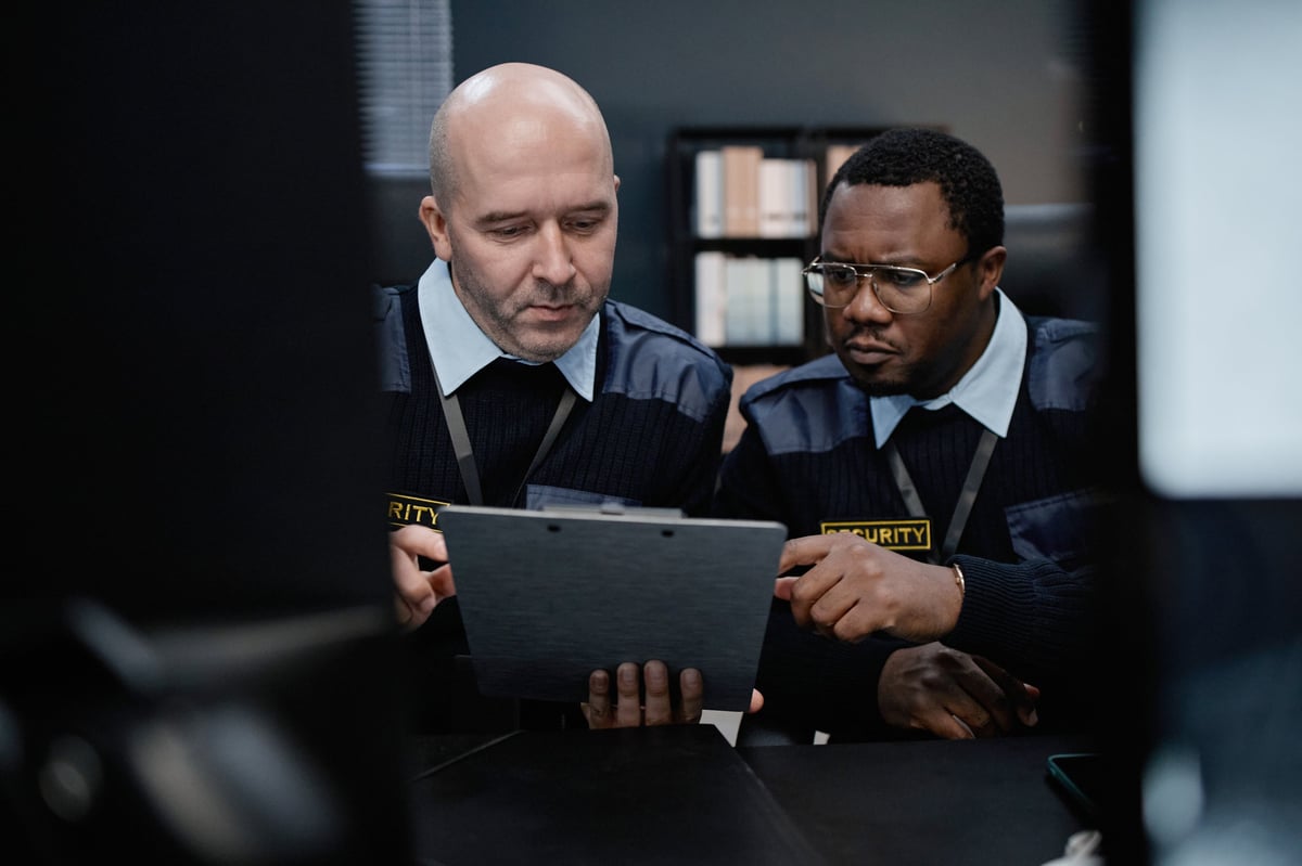 Security officers reviewing information in a control room