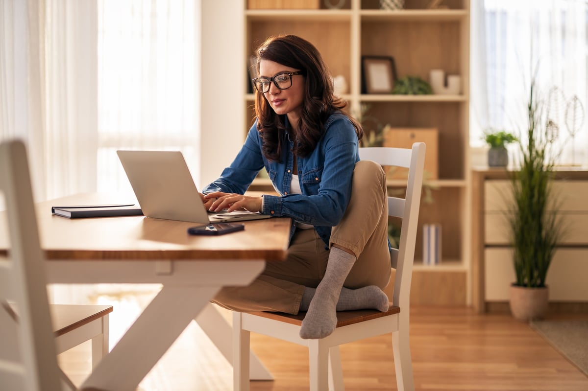Woman working from home with essentials
