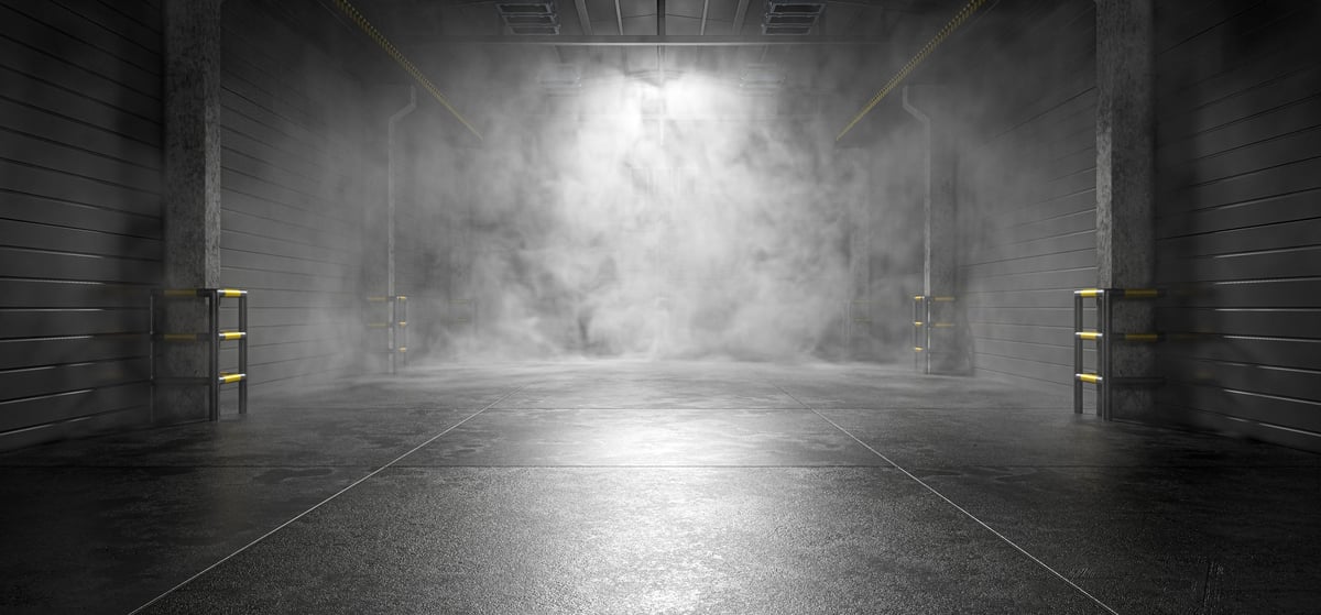 Premium luxury epoxy garage floor with dramatic lighting and dark industrial aesthetic