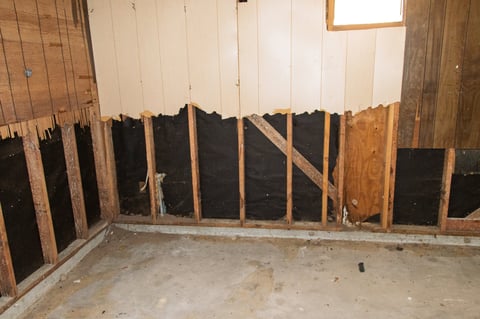 Interior wall restoration showing framing and insulation