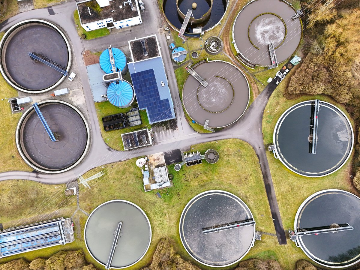 Wastewater treatment facility with large circular clarifier tanks