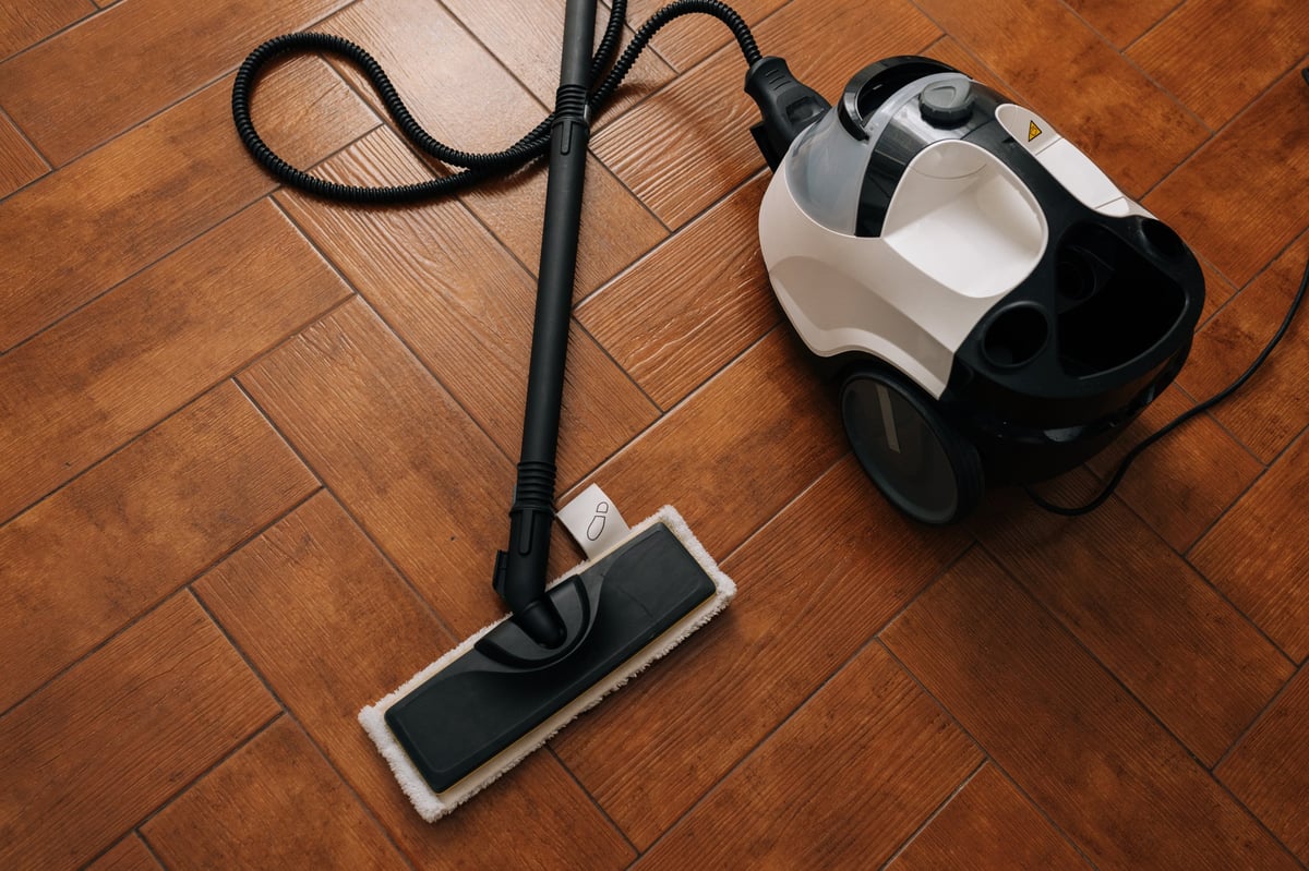 VORA vacuum on herringbone tile — powerful cleaning across every surface