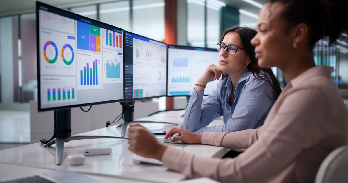 Diverse Women On Analytics Team Analyzing Financial Data At Office.