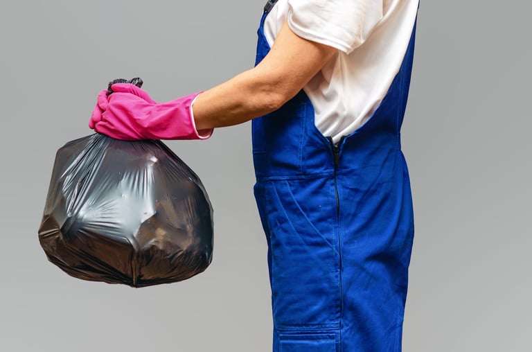Black trash bag gathered closed