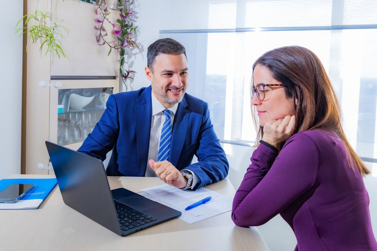 Mid adult business people discussing investment strategies during a casual office meeting