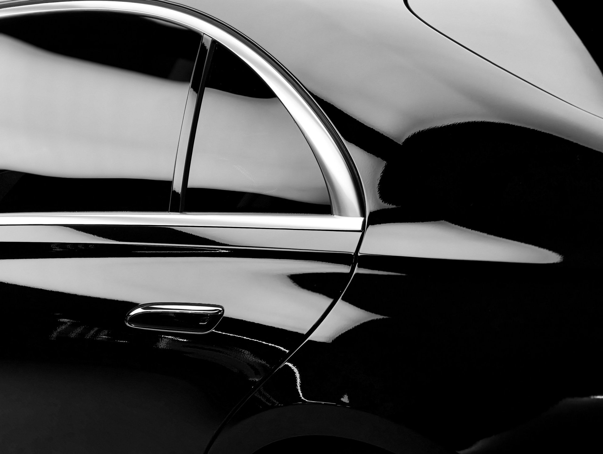 Luxury car with polished surface reflecting light
