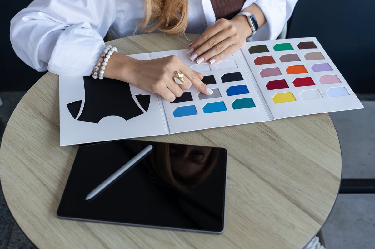 Mood board with colour palette swatches and logo sketches for brand identity development