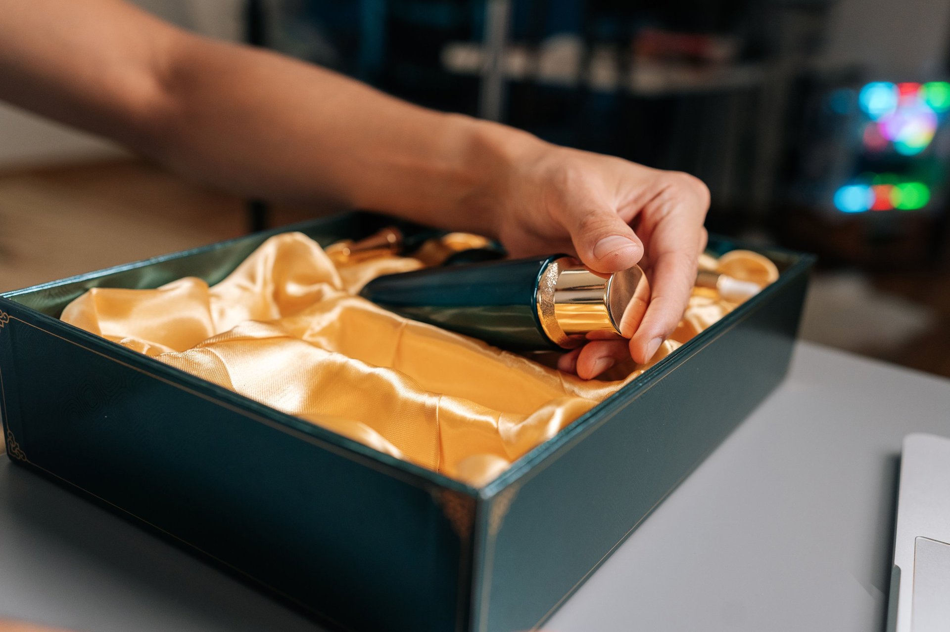 A man preparing for a premium self-care ritual — unboxing luxurious skincare