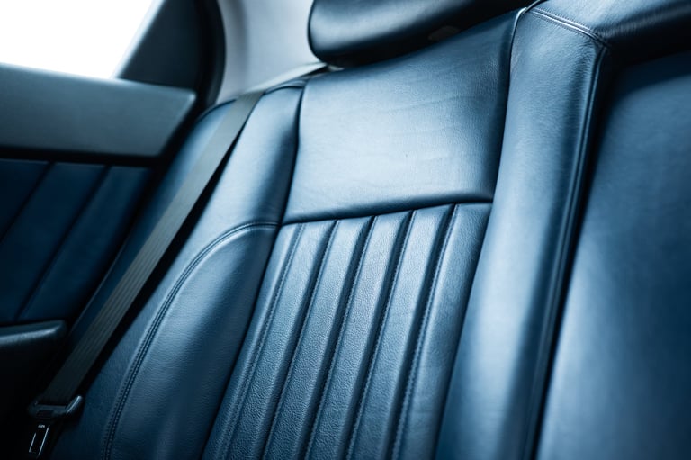 Luxury vehicle navy blue leather interior with elegant stitching