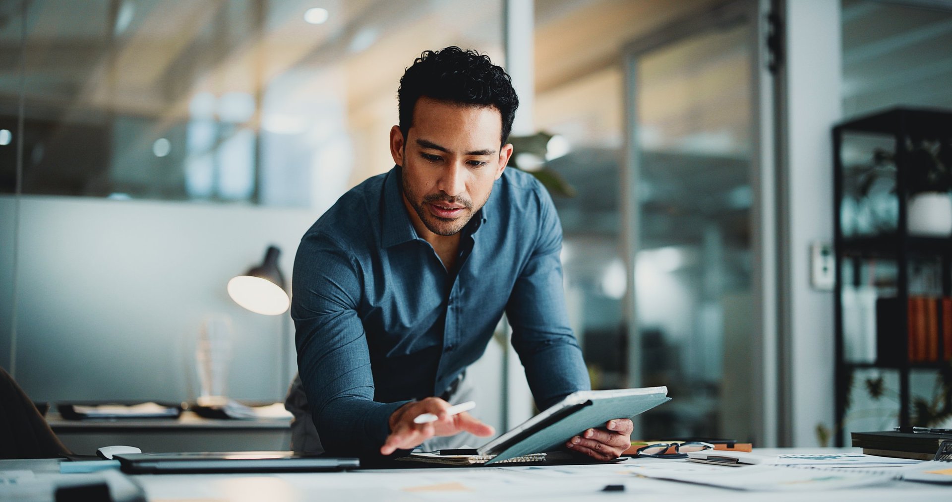 Finance review, analyst in office with tablet, funding ideas and data analysis for budget pitch