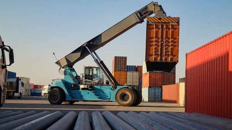 Mobile crane handling a container unit on a logistics site