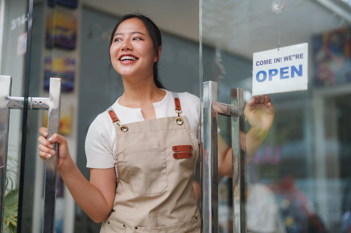 Local business owner reviewing branding concepts outdoors
