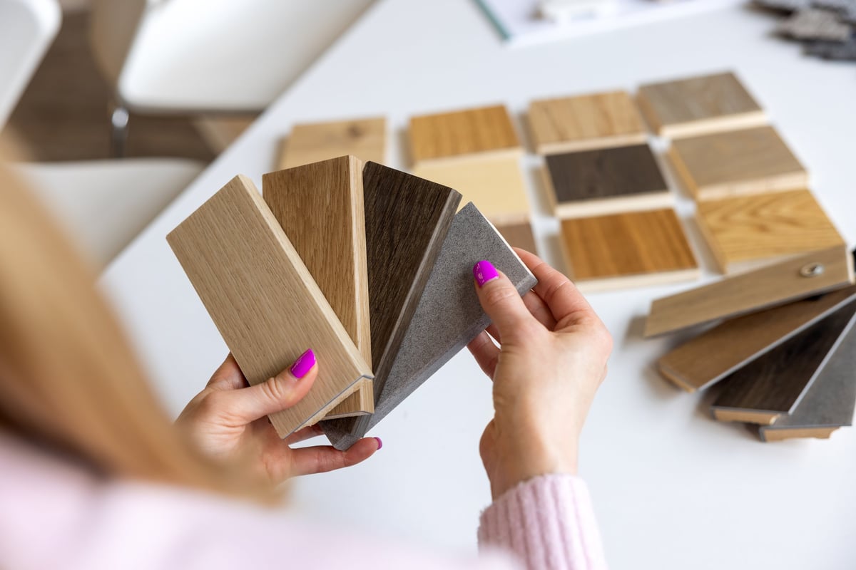 Designer selecting colours from a series of material samples in a studio