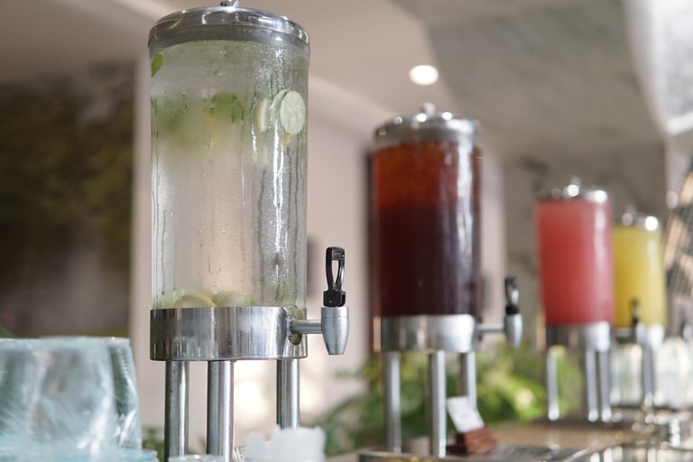 Refreshing fruit-infused drink station with glasses for a mimosa cart