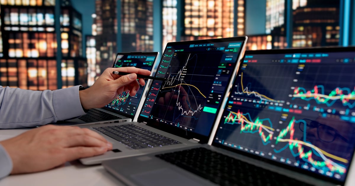 Trader monitoring market trends and making strategic trades