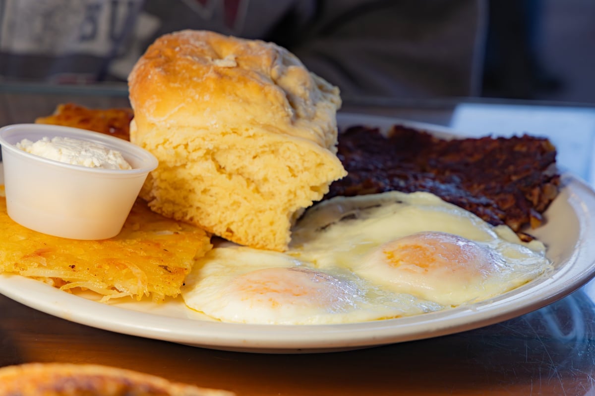 Golden biscuits and breakfast on a diner plate