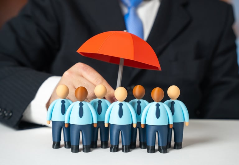 Business team under umbrella representing collective security and protection