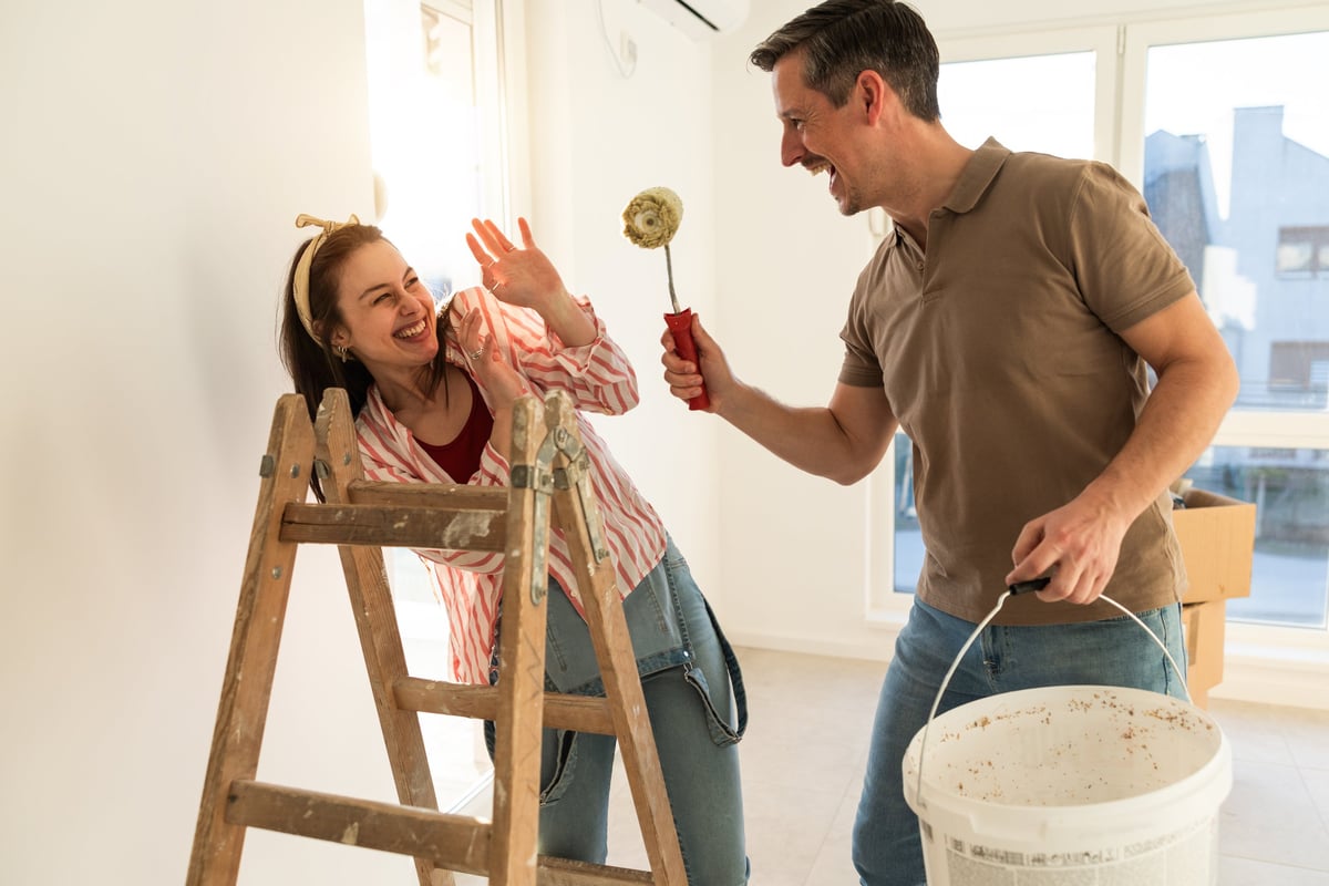 Nova Nest team painting walls together