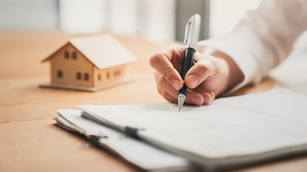 Homeowner calculating home equity options at a desk