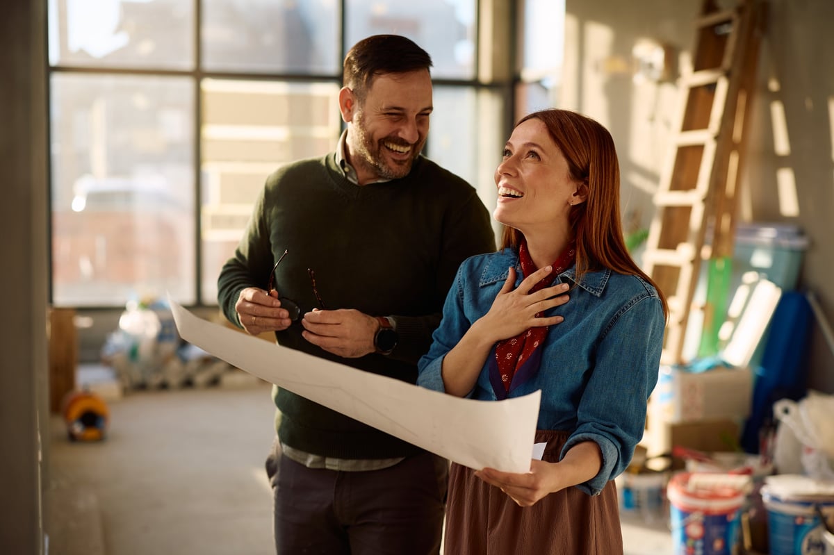 Homeowners reviewing renovation plans funded by a home equity line of credit
