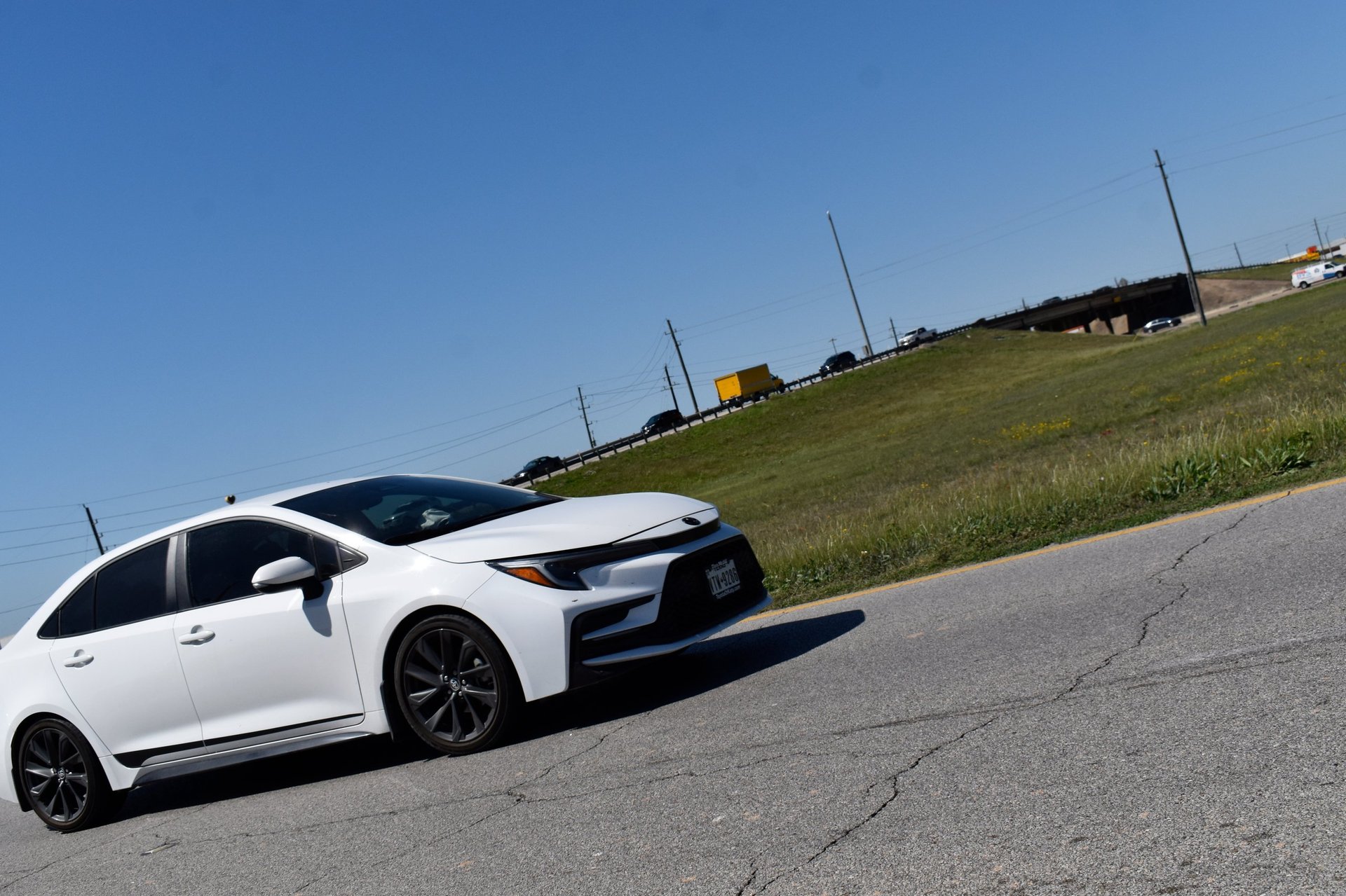 Modern sedan on the highway — economy rental from Signature Auto Rentals