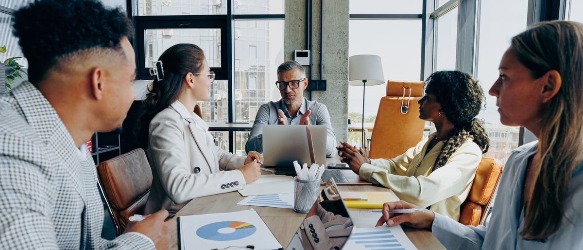 CFO and advisor reviewing historical invoices, vendor statements, and reconciliation findings in an executive office