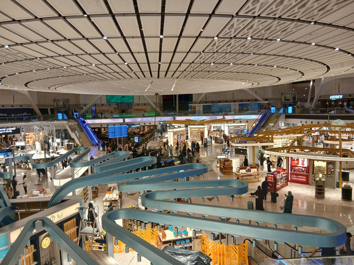 Modern international airport terminal representing cross-border investment